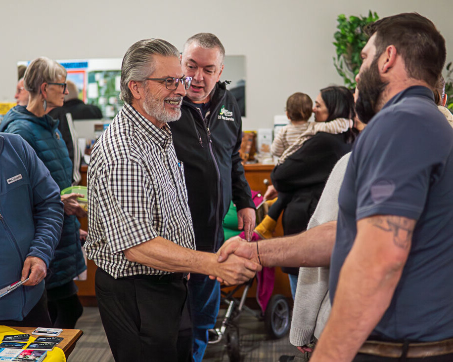 Richer Fellowship Church Congregants Shaking Hands