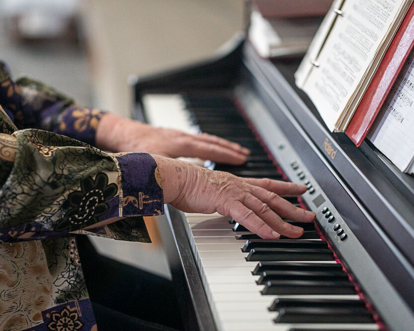 Richer Fellowship Church Woman Playing Piano
