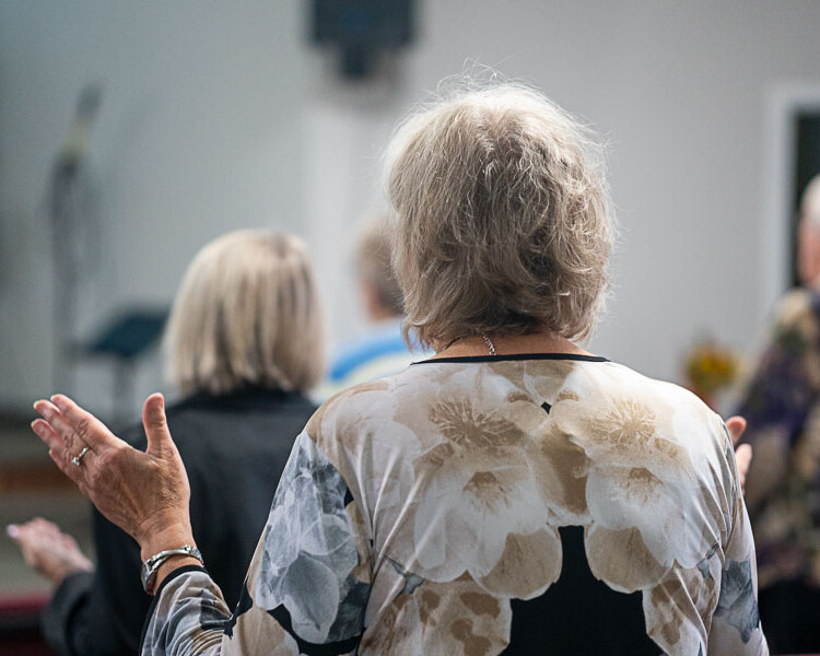 Richer Fellowship Church Woman in Worship